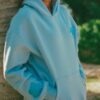 <h2>Oversized Palm Puff Blue Hoodie</h2> Celebrate life’s beauty in every note, every moment with the Palm Puff Hoodie Blue. This beautifully crafted luxurious hooded sweatshirt is sure to infuse a bit of fun into your look. So, whether you want to update your travel wardrobe or music fests, this cozy addition will let you dance in the rain and bask in the sun. <h3>Relaxed Fit for Relaxed Vibes</h3> Slip into your Oversized Palm Puff Blue Hoodie for a chilly day out at the beach or music fest. Our crafting is a labor of love and skills where imagination is unleashed. The fleece fabric of premium quality brings the ultimate comfort and warmth you need during the whole winter. The pullover closure is backed with a hooded collar, stylishly delivering the desired level of coverage. The soft rib-knitted cuffs add a functional touch to the long sleeves, maintaining its functionality with style. Slip your hands in the kangaroo-style pocket to keep them warm for the day long. Besides, this pocket helps your essentials be organized and safe. Its bold graphics and eye-catching embellishment make you stand out.